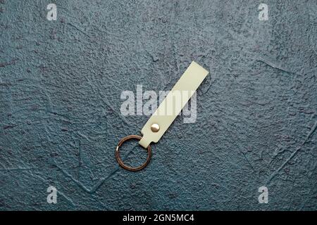 Leather keychain on dark background Stock Photo