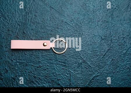 Leather keychain on dark background Stock Photo