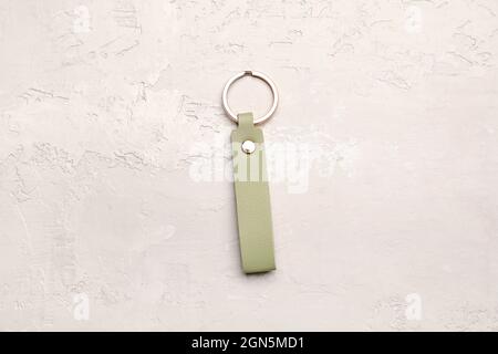 Leather keychain on light background Stock Photo