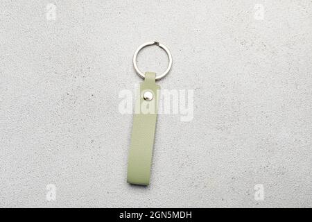 Leather keychain on light background Stock Photo