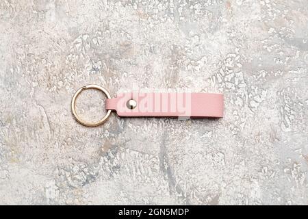Leather keychain on light background Stock Photo