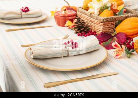 Stylish table setting with autumn decor in restaurant Stock Photo