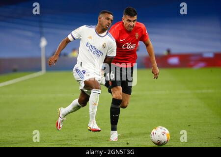 Madrid, Spain. 22nd Sep, 2021. Rodrygo of Real Madrid in action with Rodrigo Battaglia of RCD Mallorca during the La Liga match between Real madrid and RCD Mallorca at Santiago Bernabeu Stadium in Madrid, Spain. Credit: DAX Images/Alamy Live News Stock Photo