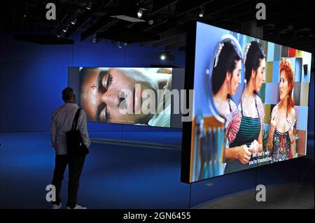 Exhibition honoring director Pedro Almodovar at the Academy Museum of Motion Pictures, Los Angeles, California features suspended screens. Stock Photo
