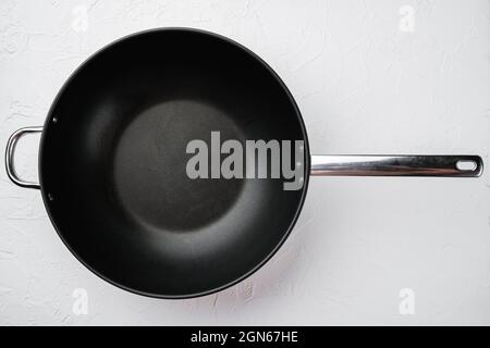 Modern non stick surface frying pan, skillet or sauce pan set with copy space for text or food with copy space for text or food, top view flat lay, on Stock Photo