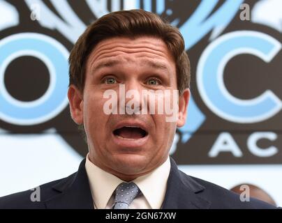 Kissimmee, United States. 22nd Sep, 2021. Florida Gov. Ron DeSantis speaks during a press conference before newly appointed state Surgeon General Dr. Joseph Ladapo at Neo City Academy in Kissimmee, Florida.A day after being appointed, Ladapo instituted his first rule giving parents 'sole discretion' over whether their child wears a mask at school, and also allowing students who come in contact with the coronavirus to continue attending class if they remain asymptomatic. Credit: SOPA Images Limited/Alamy Live News Stock Photo