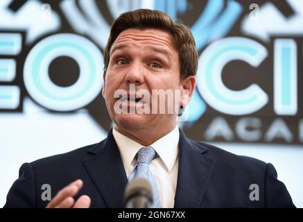 Kissimmee, United States. 22nd Sep, 2021. Florida Gov. Ron DeSantis speaks during a press conference before newly appointed state Surgeon General Dr. Joseph Ladapo at Neo City Academy in Kissimmee, Florida.A day after being appointed, Ladapo instituted his first rule giving parents 'sole discretion' over whether their child wears a mask at school, and also allowing students who come in contact with the coronavirus to continue attending class if they remain asymptomatic. Credit: SOPA Images Limited/Alamy Live News Stock Photo