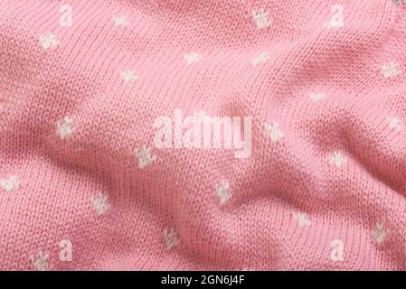 Close up of pink knitted textured background. Trendy colors. Stock Photo