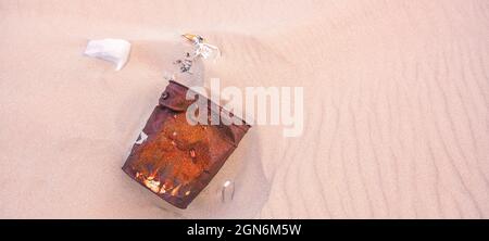 Close Up Of Rusted Can Weathered On Beach Sand Pollution Litter Rubbish In The Baltic sea Stock Photo