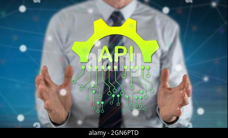 Api concept between hands of a man in background Stock Photo