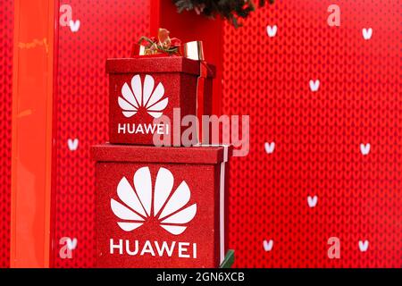 Kyiv, Ukraine - January 13, 2021: Close up christmas gift box with Huawei logo at the Christmas fair. Christmas Holidays at Palace Ukraine. Stock Photo