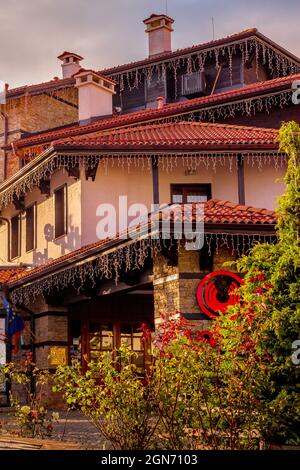 Bansko, Bulgaria - October 31, 2020: Autumn Pirin street and Uniqato hotel and colorful trees Stock Photo