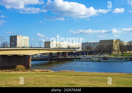 Dresden, Saxony, Germany: Modern buildings and synagogue, as well as a steamboat on the Elbe, seen from the Königsufer riverside below Carola Bridge. Stock Photo