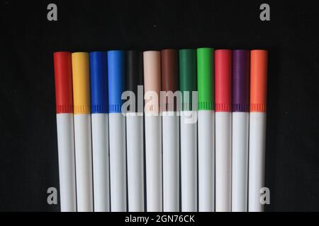 an array of markers or colored pencils produces a beautiful bright colorful pattern, for a colorful and vibrant life Stock Photo
