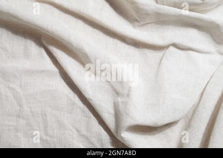 crumpled linen textile with shadow. Organic Eco material. Minimalistic cozy light background. kinfolk design  Stock Photo