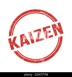 KAIZEN text written on red grungy vintage round stamp. Stock Photo