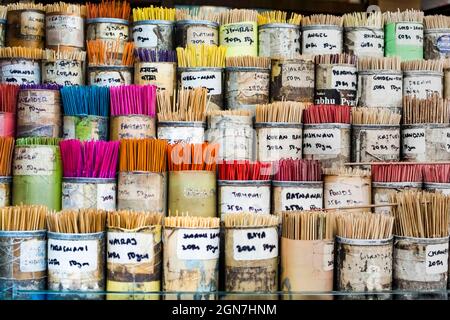incense sticks or Dhoop sticks for sale on a shop counter in a market in Mumbai. India Stock Photo