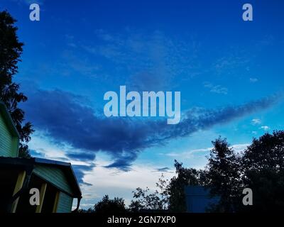 beautiful clouds on the sky covering the sun. deep blue sky Stock Photo