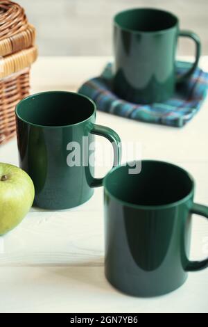 Green plastic kitchenware on a table close up Stock Photo