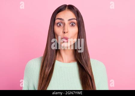 Photo of impressed young brunette lady wear green pullover isolated on pink color background Stock Photo