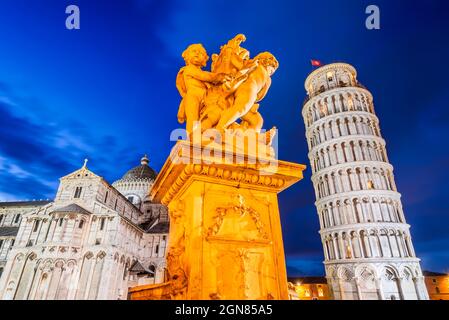 Pisa, Italy. Campo dei Miracoli with Putti Fountaind and Leaning Tower, world famous attraction in Tuscany. Stock Photo