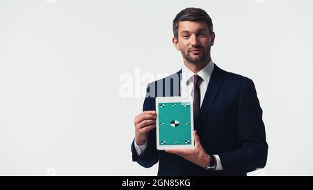 Businessman holding digital tablet with chroma key isolated on white Stock Photo