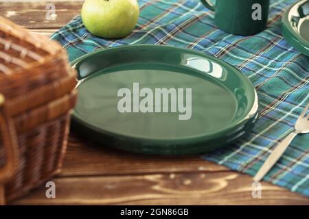 Green plastic kitchenware on a table close up Stock Photo