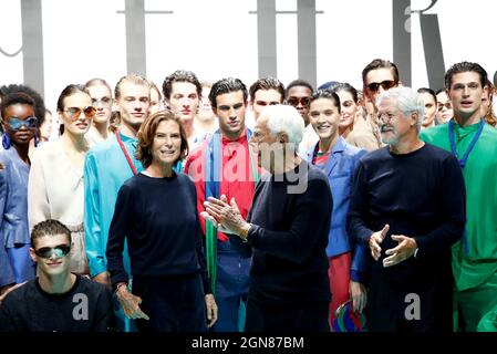 Giorgio Armani, Silvana Armani and Sergio Galeotti pose with models after  presenting the Emporio Armani Spring/