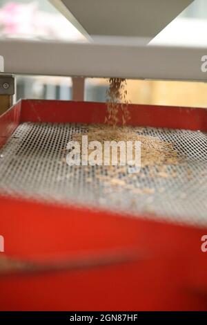 Factory machine Milling rice in close up Stock Photo