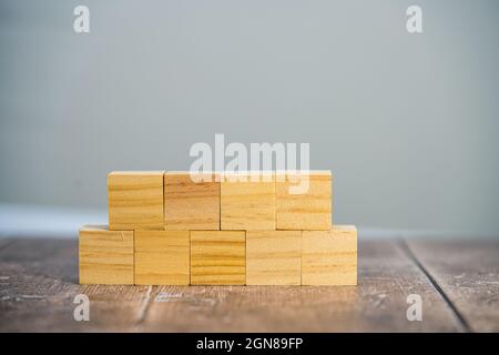 Blank wooden square cube mock up, two horizontal rows four and five blocks  with a simple background Stock Photo