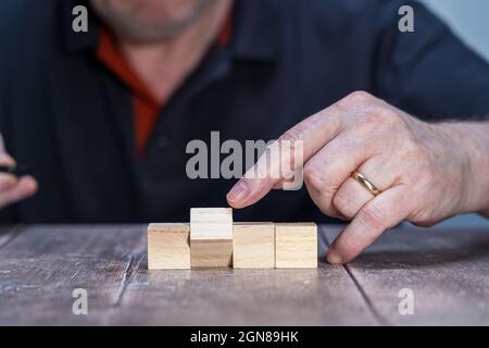 blank template mock up of four wooden blocks with one pivoted for use in creating artwork , slogan or advertising Stock Photo