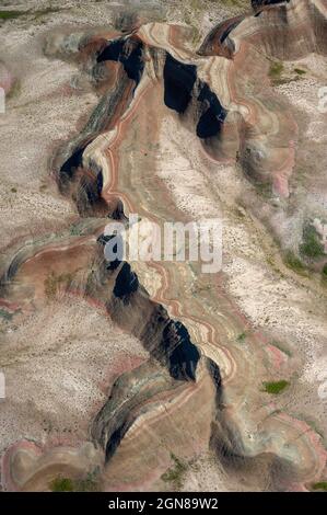 Aerial view of eroded rock formations in Badlands National Park, South Dakota.