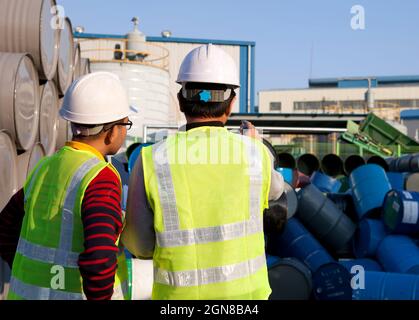 Manufacture workers checking drums Stock Photo