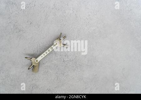 New Stainless steel Multi tool Screwdriver set on a plain wood background top view flat lay of brushed concrete Stock Photo
