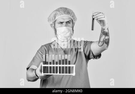 Epidemic threshold. Critical number or density of susceptible hosts. Man in medical lab inspecting samples biological material. Epidemic disease Stock Photo