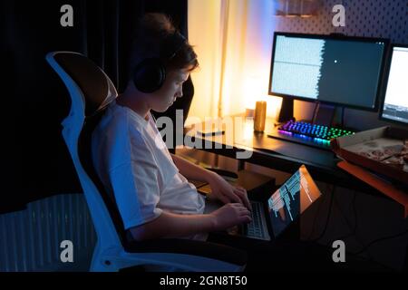 Boy using laptop at home Stock Photo