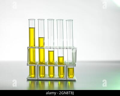 Oil in test tubes on table Stock Photo