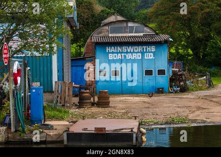 Hainsworth's Boatyard Ltd sheds (repair & service, chandlery, business selling fuel) - Leeds and Liverpool Canal, Bingley West Yorkshire England, UK. Stock Photo