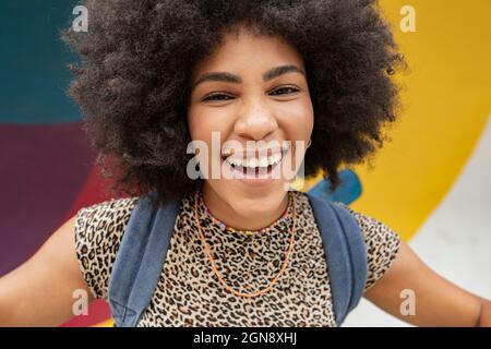 Cheerful young woman with black Afro hairstyle Stock Photo