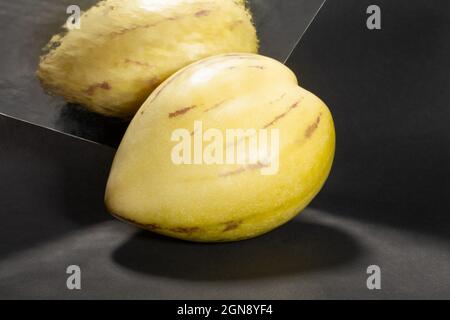 mirrored pepino on black background Stock Photo
