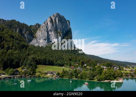 Austria, Upper Austria, Plomberg, Drone view of lakeshore village at foot of Drachenwand mountain Stock Photo
