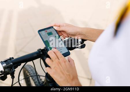 Delivery woman checking map on smart phone Stock Photo
