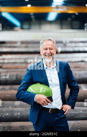 Smiling male business professional in industry Stock Photo