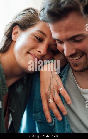 Couple using digital tablet at home Stock Photo