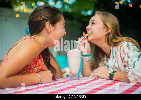 Backyard portrait of friends  dringing together Stock Photo