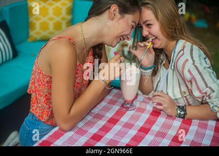 Backyard portrait of friends drinking together Stock Photo