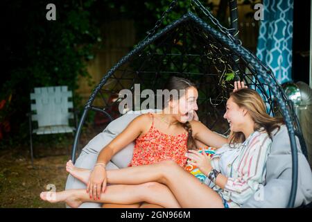 Backyard portrait of friends laughing Stock Photo