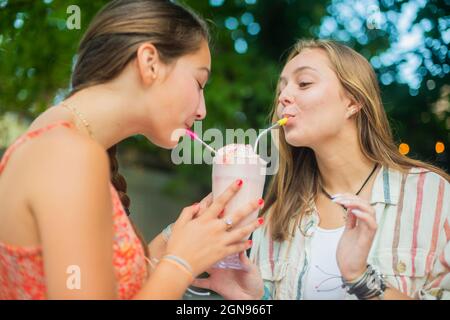 Backyard portrait of friends drinking together Stock Photo