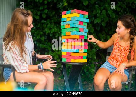 Backyard portrait of friends playing a game Stock Photo