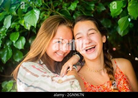 Backyard portrait of friends  laughing Stock Photo
